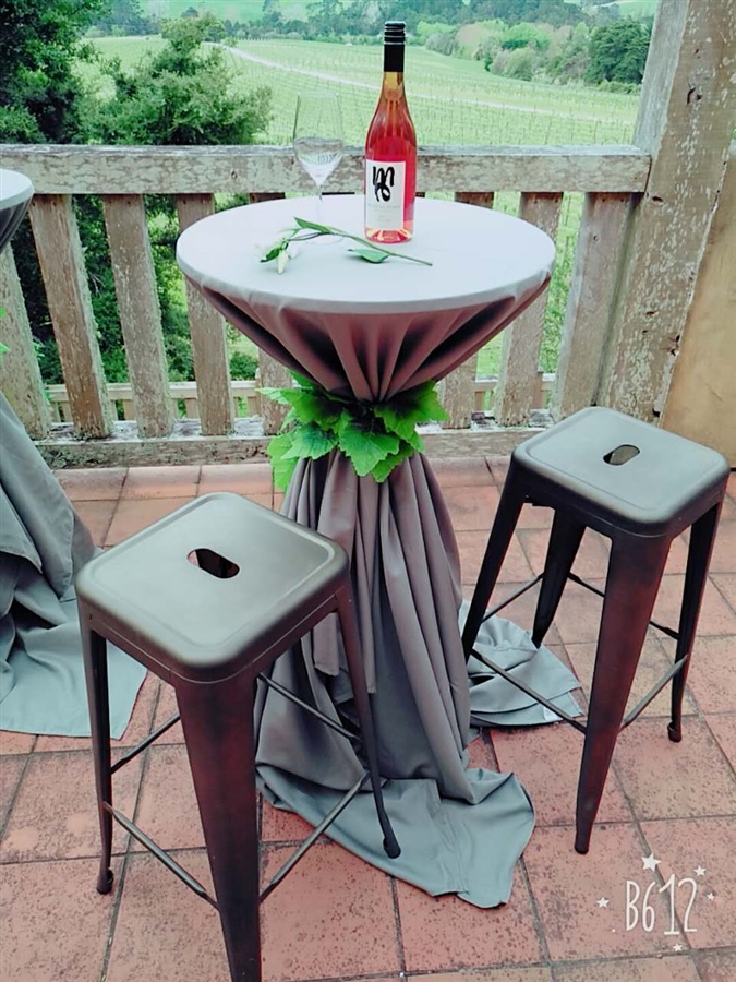Bar Leaner with Grey Table Cloths and 2 Stools